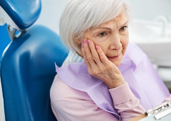 Illustrative image of an elderly patient experiencing jaw and TMJ-related pain. This image is illustrative and does not depict the actual patient.